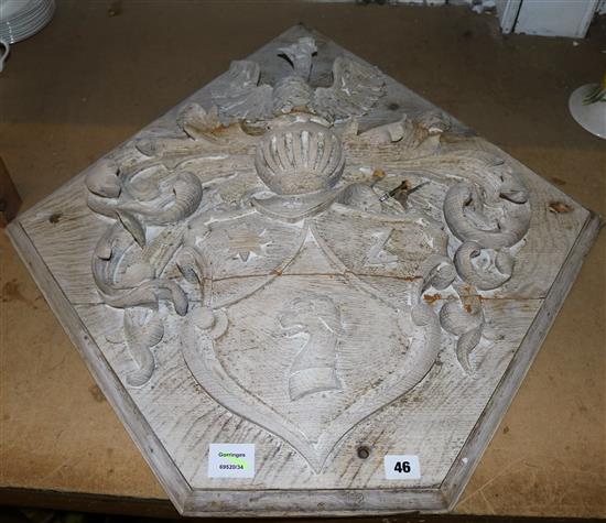 A lined, carved wood hatchment